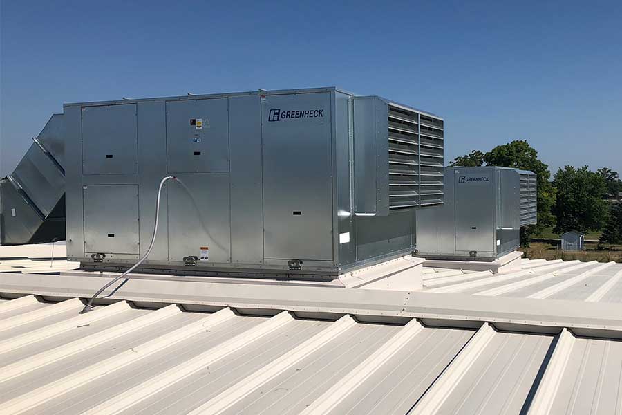 Industrial HVAC system mounted on a metal roof.