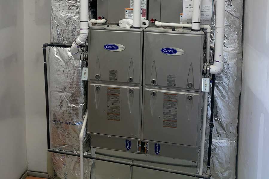 Dual Carrier furnaces installed in a mechanical room